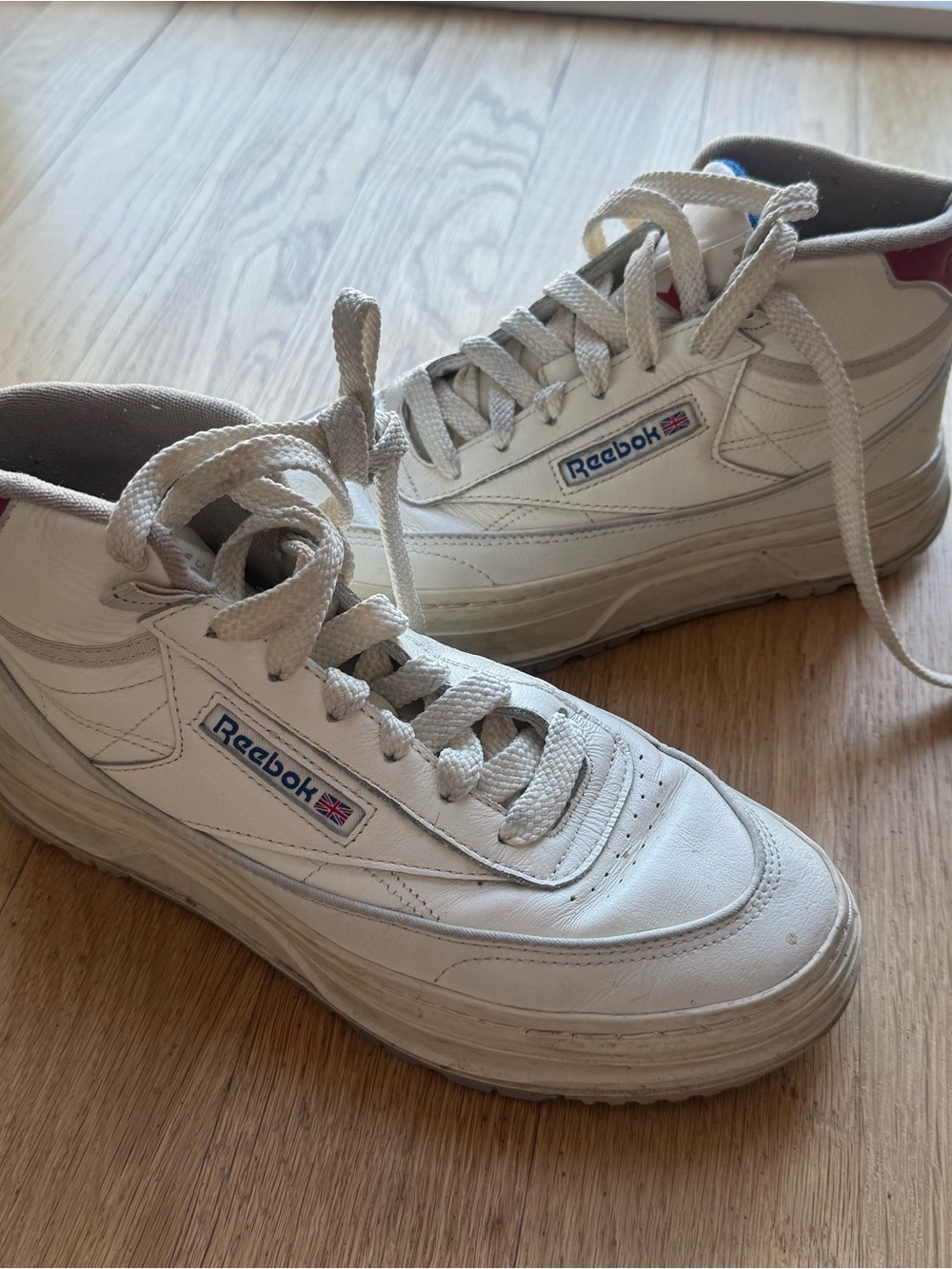 Reebok White Leather High- Top Sneakers